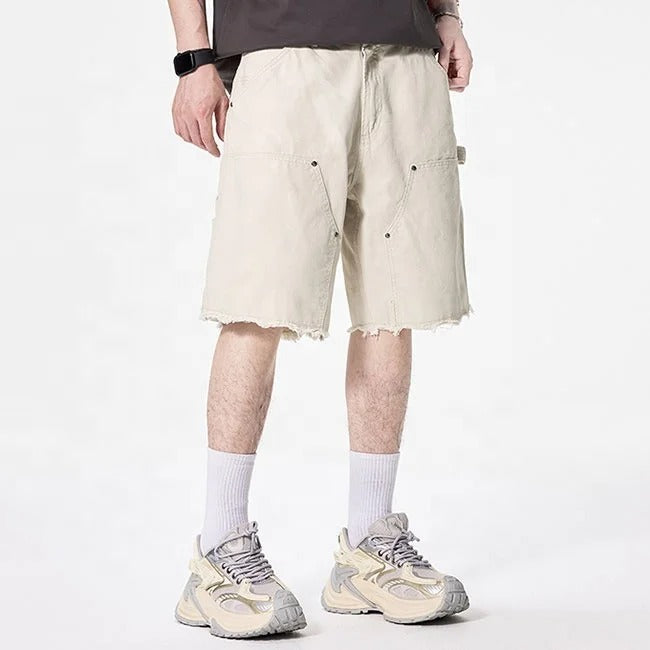 Beige cargo shorts with utility pockets and raw hem