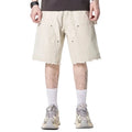 Beige cargo shorts with utility pockets and raw hem