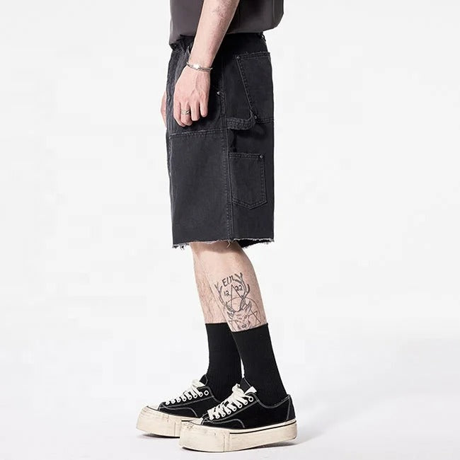 Black cargo denim shorts with utility pockets and raw hem