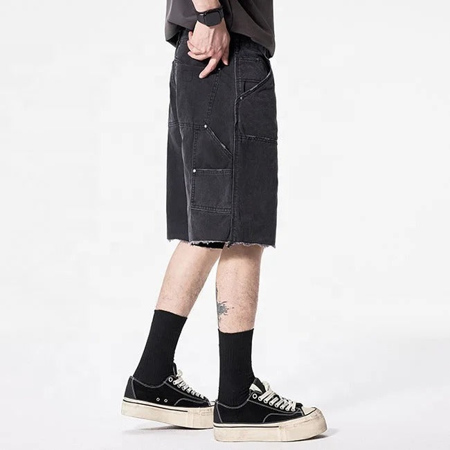 Black cargo denim shorts with utility pockets and raw hem
