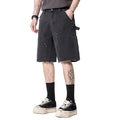 Black cargo denim shorts with utility pockets and raw hem