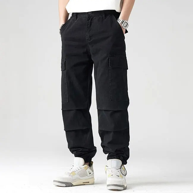 Black cargo pants with flap pockets and elastic cuffs
