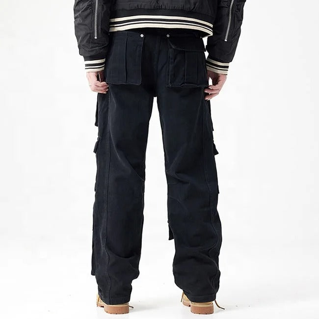 Black cargo pants with multiple flap pockets and panel detailing