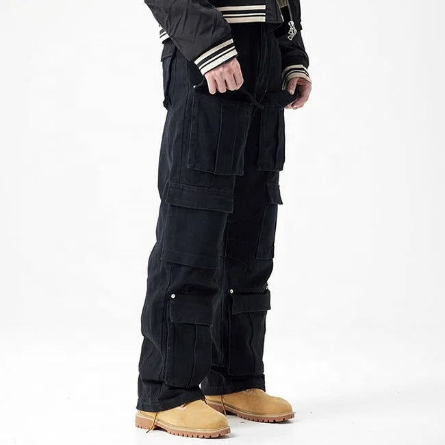 Black cargo pants with multiple flap pockets and panel detailing