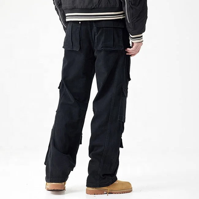 Black cargo pants with multiple flap pockets and panel detailing