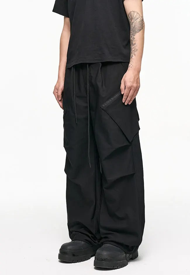 Black wide-leg cargo pants with side flap pockets
