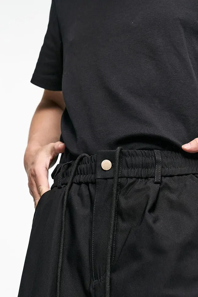 Black wide-leg cargo pants with side flap pockets