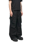 Black wide-leg cargo pants with side flap pockets