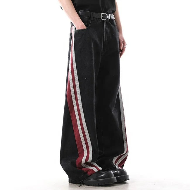 Black wide-leg jeans with red and white side stripe panels