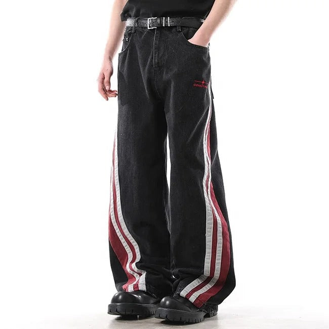 Black wide-leg jeans with red and white side stripe panels