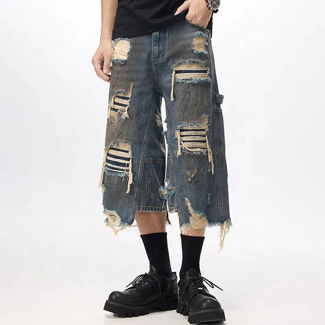 Dark blue distressed denim shorts with ripped detailing