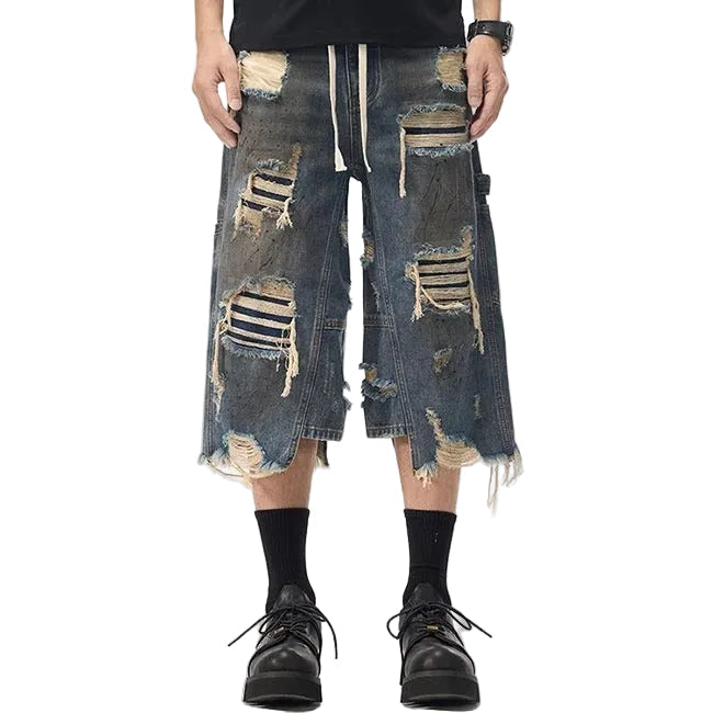 Dark blue distressed denim shorts with ripped detailing