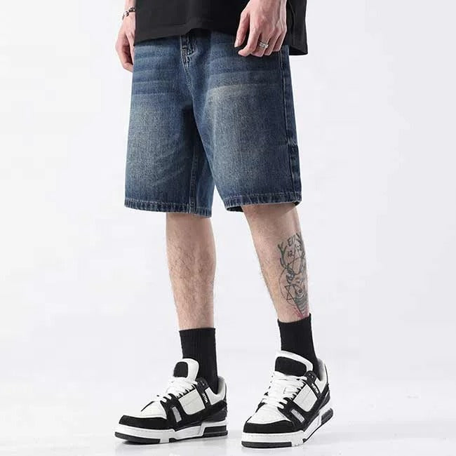 Dark blue washed denim shorts with faded detailing
