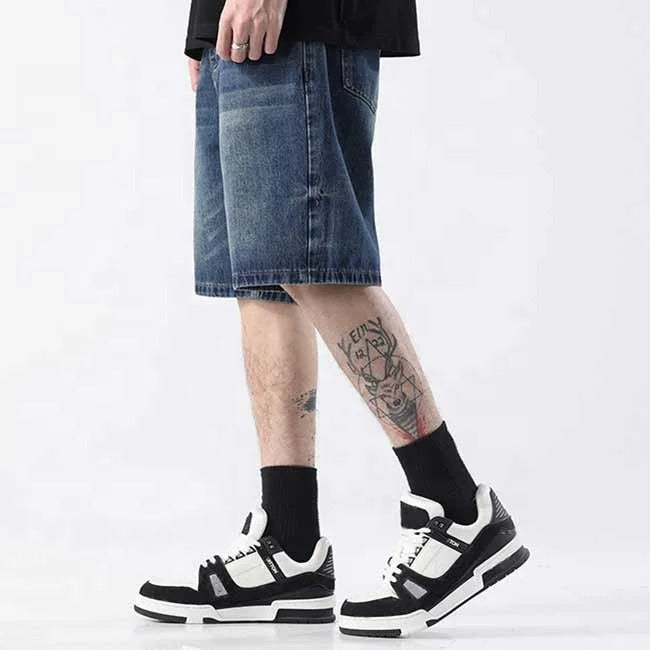Dark blue washed denim shorts with faded detailing
