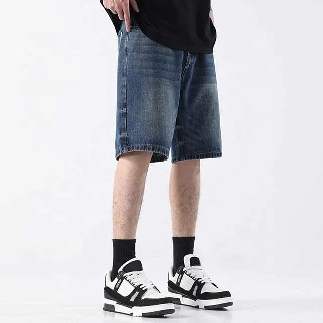 Dark blue washed denim shorts with faded detailing