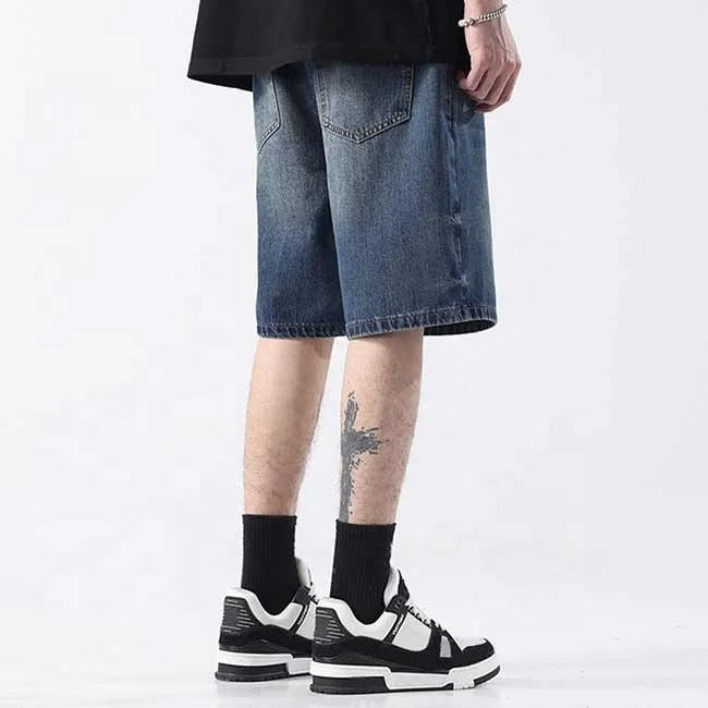 Dark blue washed denim shorts with faded detailing
