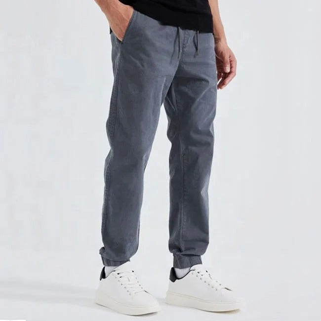 Grey tapered jogger pants with elastic cuffs