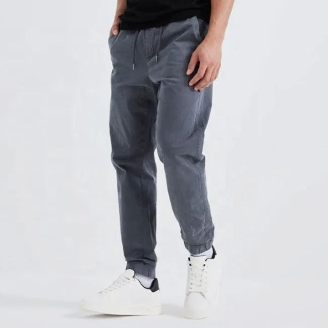 Grey tapered jogger pants with elastic cuffs