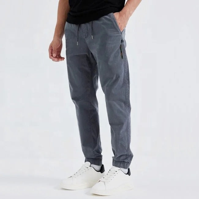 Grey tapered jogger pants with elastic cuffs