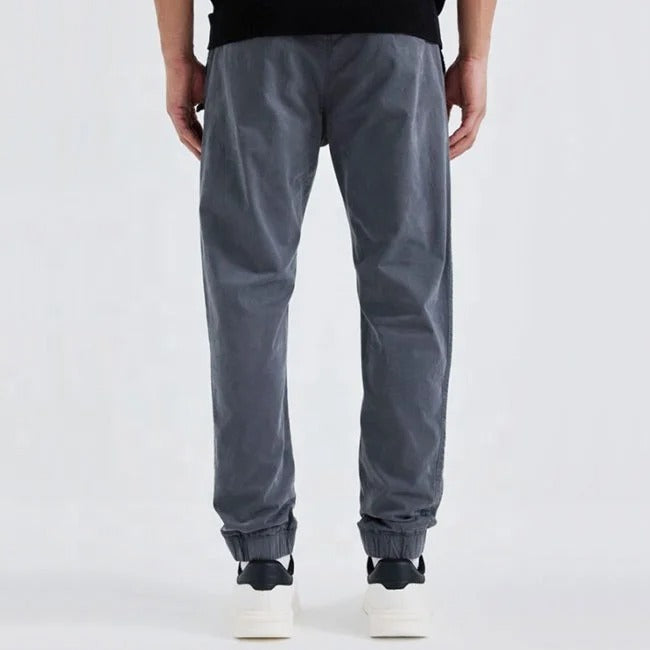 Grey tapered jogger pants with elastic cuffs