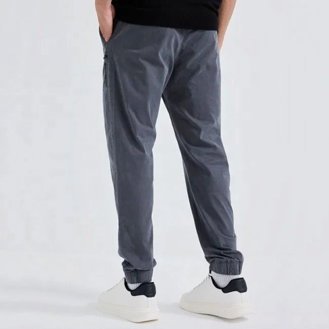 Grey tapered jogger pants with elastic cuffs