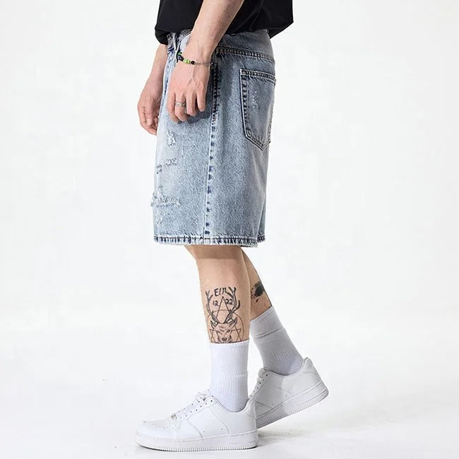 Light blue distressed denim shorts with faded wash