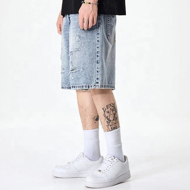 Light blue distressed denim shorts with faded wash