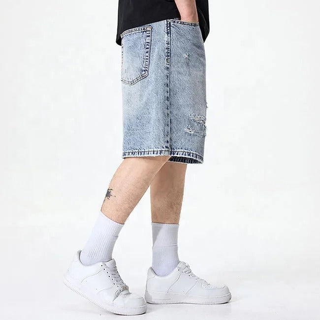 Light blue distressed denim shorts with faded wash