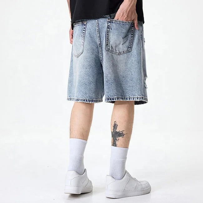 Light blue distressed denim shorts with faded wash