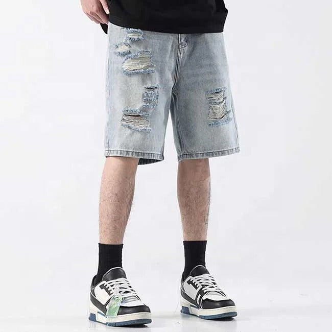 Light blue distressed denim shorts with ripped detailing