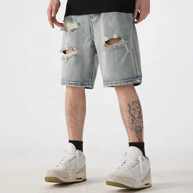 Light blue distressed denim shorts with ripped detailing