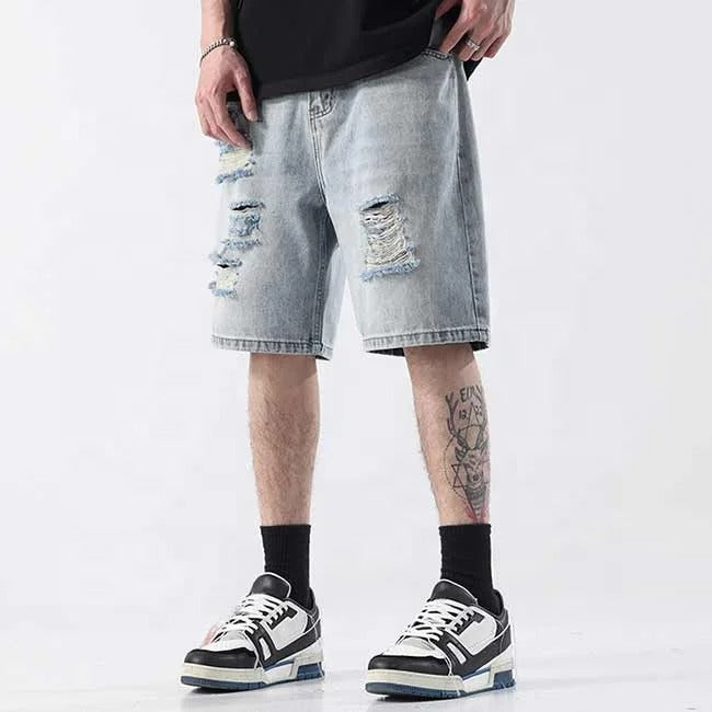 Light blue distressed denim shorts with ripped detailing