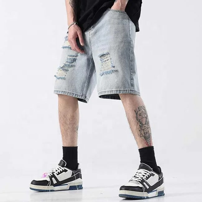 Light blue distressed denim shorts with ripped detailing