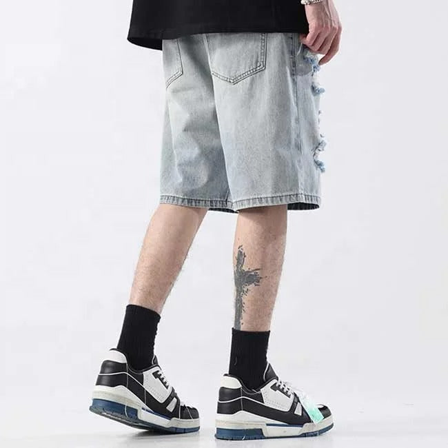 Light blue distressed denim shorts with ripped detailing
