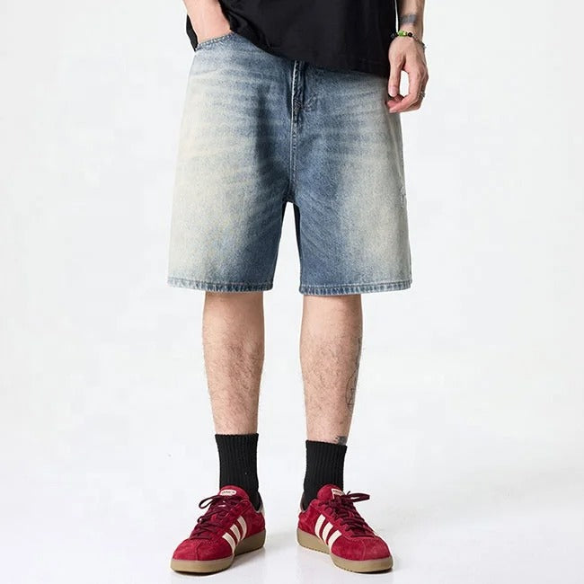 Light blue washed denim shorts with gradient fade