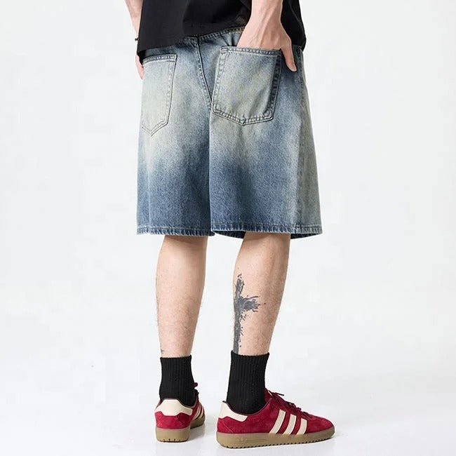 Light blue washed denim shorts with gradient fade