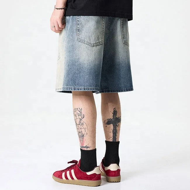 Light blue washed denim shorts with gradient fade