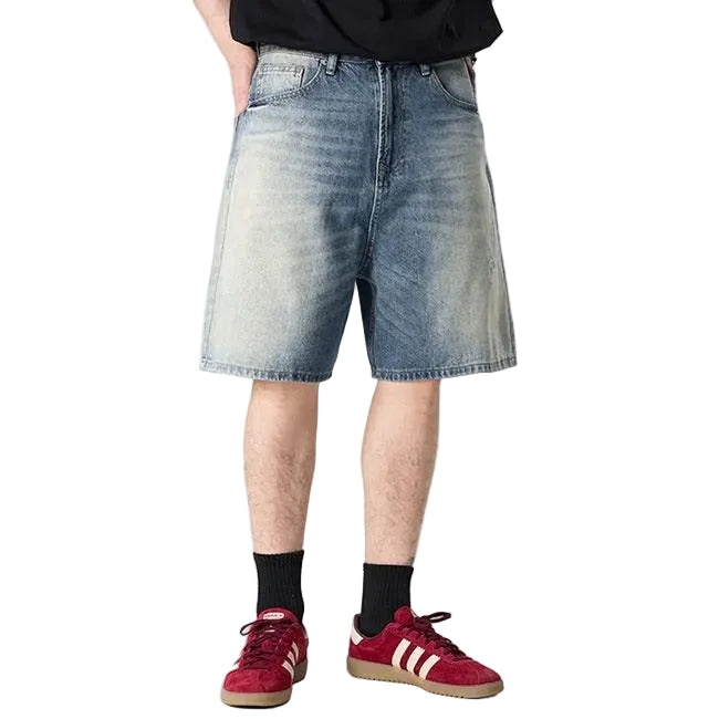 Light blue washed denim shorts with gradient fade