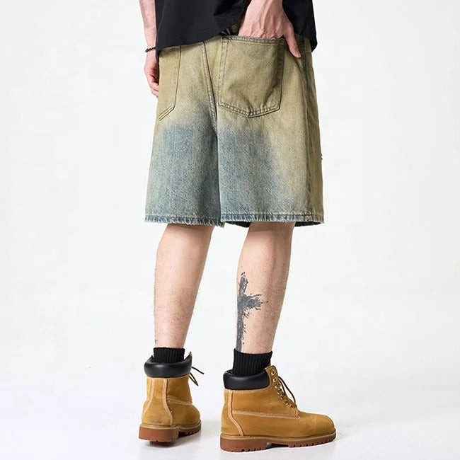 Olive green washed denim shorts with subtle distressing