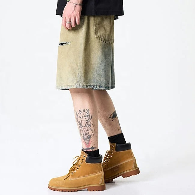 Olive green washed denim shorts with subtle distressing