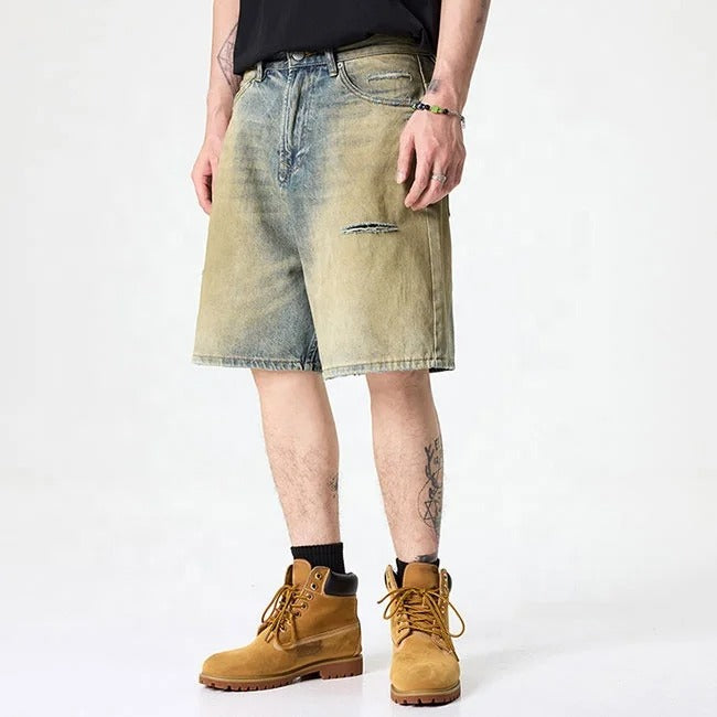 Olive green washed denim shorts with subtle distressing